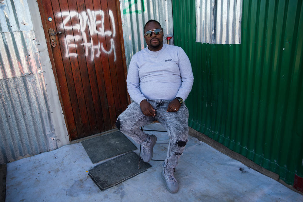 Thembile Gatyeni is one of several community-appointed leaders in Covid. Each leader is responsible for a specific neighborhood and may go door-to-door to collect money for running water, food distribution and other services. These leaders are the go-to people for any complaints.