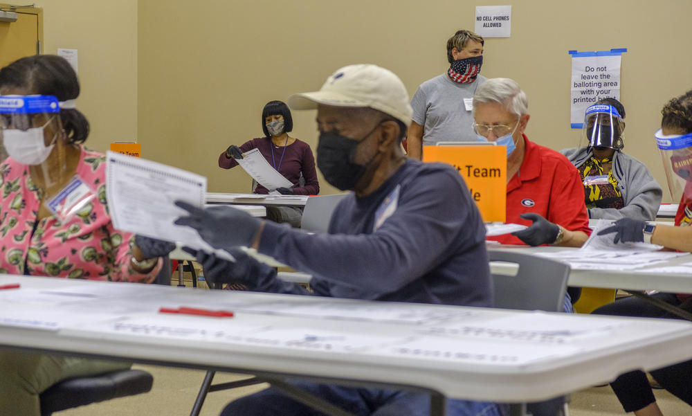 Auditors count part of the  71,000 presidential ballots in Macon, Ga.