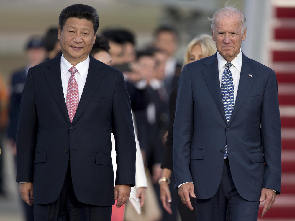 Chinese President Xi Jinping and then-Vice President Joe Biden in 2015 at an arrival ceremony at Joint Base Andrews. China recognized Biden's election as president Friday.