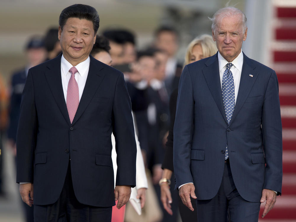 Chinese President Xi Jinping and then-Vice President Joe Biden in 2015 at an arrival ceremony at Joint Base Andrews. China recognized Biden's election as president Friday.