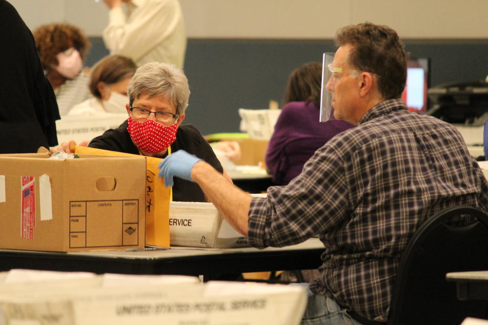 Election workers in Cobb County, Ga., begin a hand recount of ballots Friday in the presidential election.