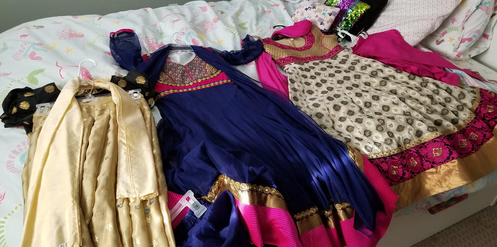 The traditional Indian clothing of Sarita Talusani Keller's daughter, 9-year-old Leela, is laid out in her bedroom. Every Diwali, she would wear one of these outfits to celebrate the festival.