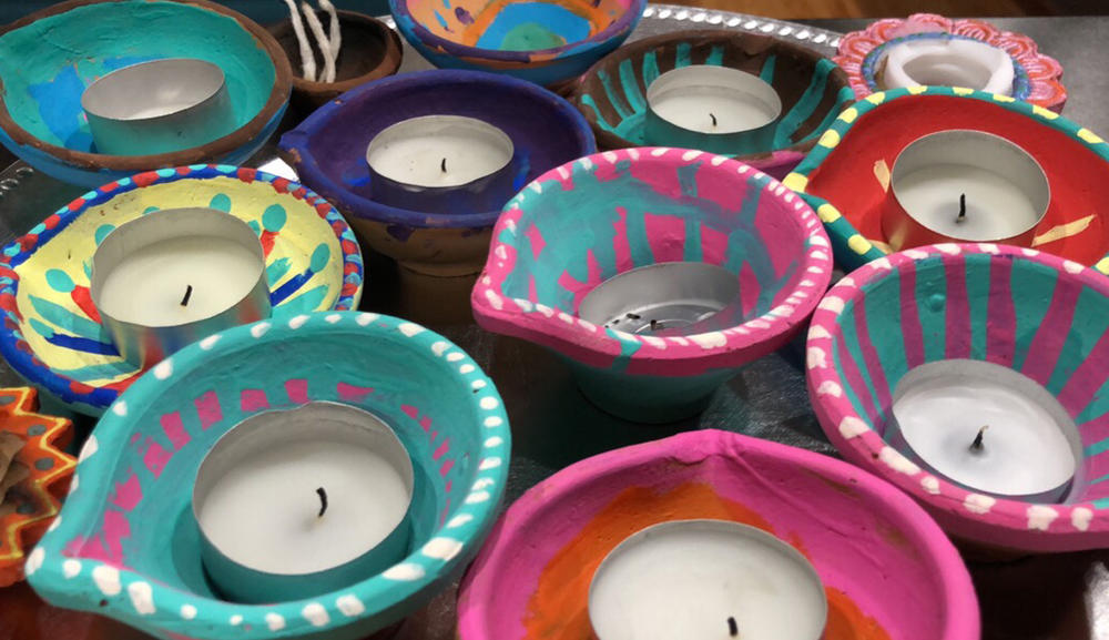 Painted Diyas by Sarita Talusani Keller and her daughter, Leela, laid out on the kitchen counter, ready to be lit for Diwali night in 2017.