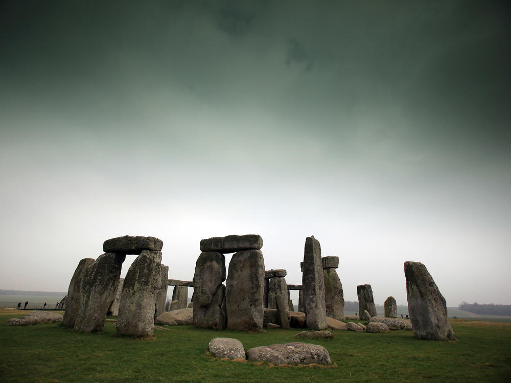 Visitors and tourists walk around the ancient monument at Stonehenge in 2012 in Wiltshire, England.
