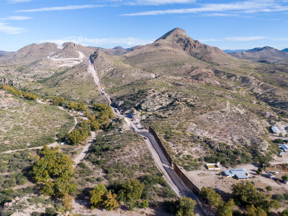 A portion of the border wall is under construction in Arizona's Guadalupe Canyon, which is a wildlife corridor for Mexican gray wolves and endangered jaguars. The United States is on the left.