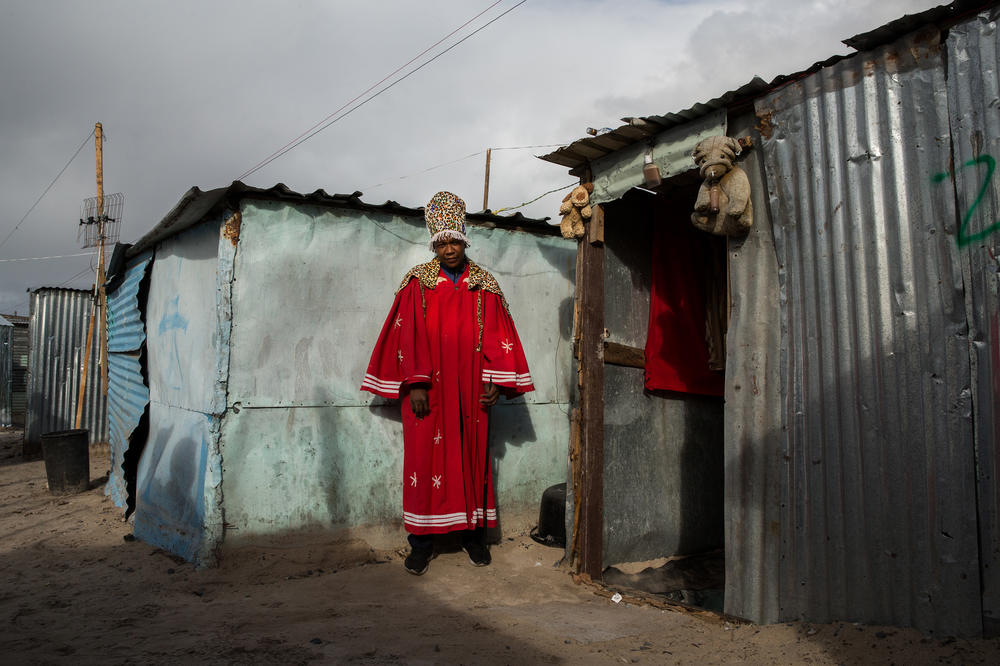 Masakhe Nolakoza, a traditional healer, has lived in Covid since early April. He previously lived in a shack in someone's backyard in Mfuleni, the neighboring township. His business has not been good in the new location. 