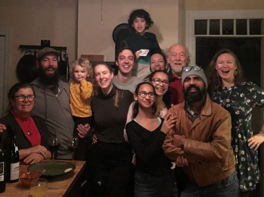 Jasmine Surti (far right) and three generations of her family celebrating Thanksgiving in Philadelphia in 2018. From left, front: Louise Aucott, Gabe Aucott with Juniper Chamberlin, Rachel Aucott, Sandhya Surti, Anjali Surti, Hemant Surti, Jasmine Surti 2nd row, starting from center: Steve Hoenstine, Aimee Landau, Mike Aucott Top: Ezra Landau.