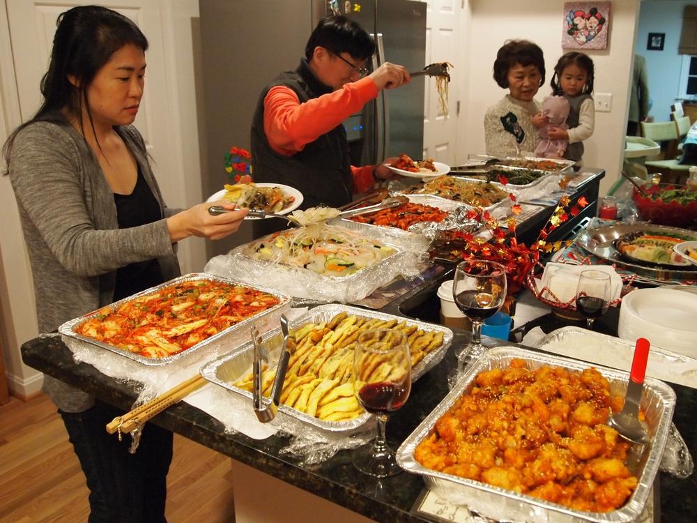 Linh Song's family celebrates Thanksgiving in 2017. From left, Suzan Song, unknown man, Sue Song holding Soona Song