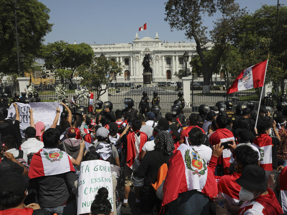 Protesters gather outside Congress in Lima, Peru, after interim President Manuel Merino announced his resignation following massive protests unleashed when lawmakers ousted President Martín Vizcarra.