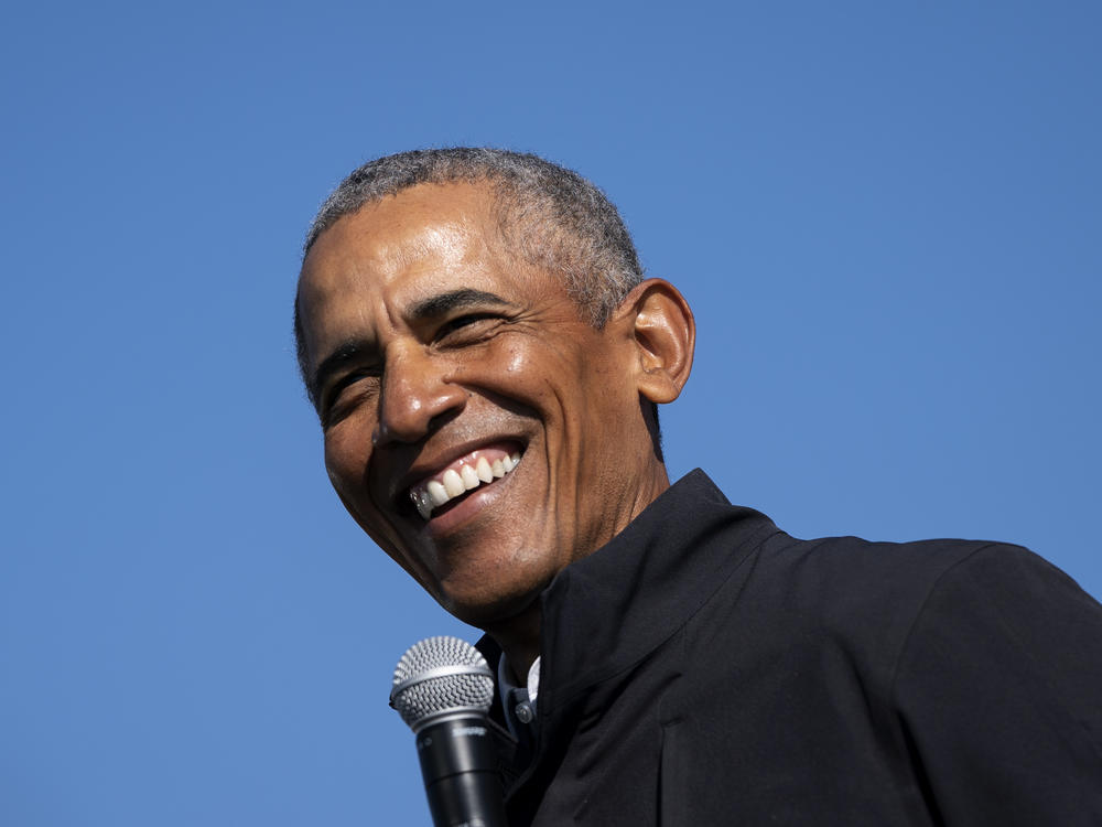 Former President Barack Obama speaks during a drive-in campaign rally for Joe Biden on Oct. 31 in Flint, Michigan.