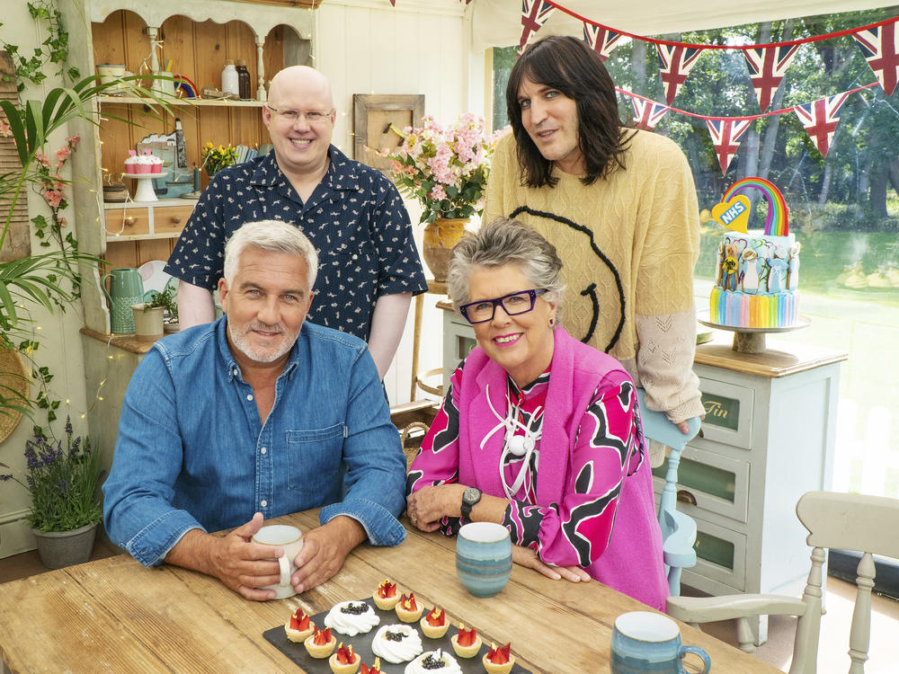 Comedian Matt Lucas — top left — joins cohost Noel Fielding and judges Paul Hollywood and Prue Leith in the tent for the new series of <em>The Great British Baking Show</em> (as it's known in the U.S.)