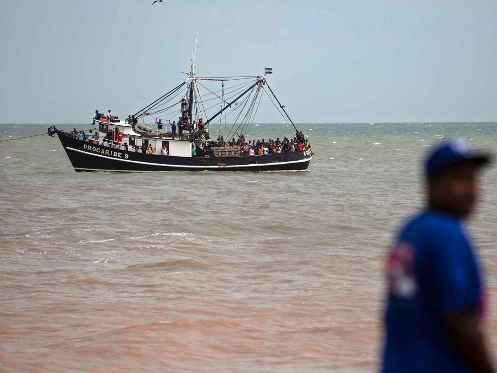 Navy members help evacuate people on a boat from the Karata and Wawa Bar communities ahead of the arrival of Hurricane Iota in Bilwi, Puerto Cabezas, Nicaragua, on Sunday.