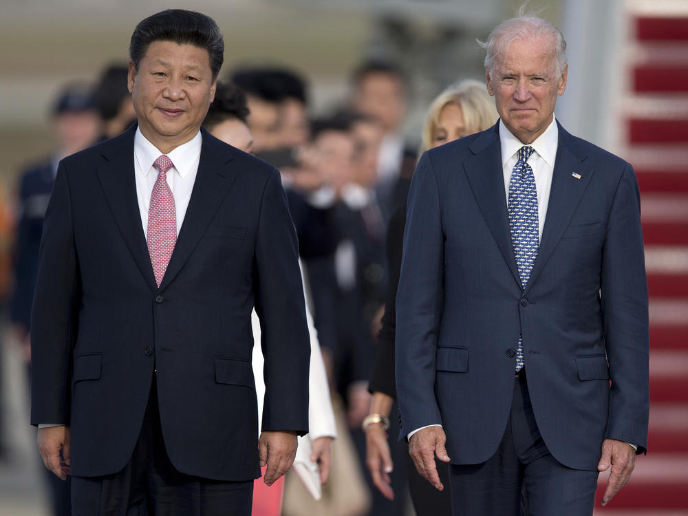 Chinese President Xi Jinping and then Vice President Joe Biden attend an arrival ceremony in Andrews Air Force Base, Md., in 2015. Biden is under pressure from both the left and the right to continue taking a hard line on trade with China.