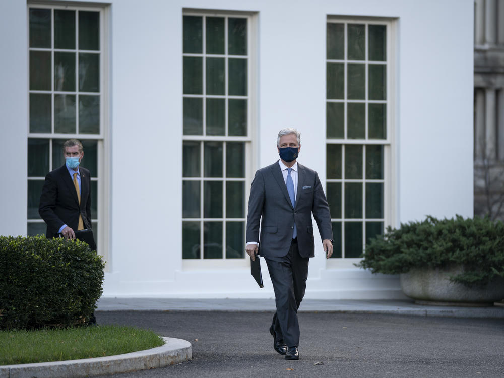 National security adviser Robert O'Brien arrives to speak to reporters outside the White House on Tuesday. O'Brien announced that President Trump has ordered 2500 U.S. troops to be withdrawn from Afghanistan and Iraq by Jan. 15.
