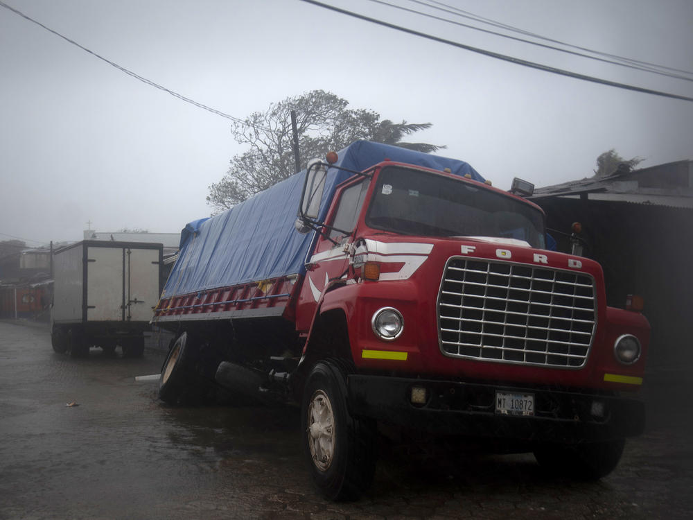 A truck flounders in a flooded street in Puerto Cabezas, Nicaragua, just hours before Hurricane Iota made landfall in the country Monday night. By Tuesday morning, the storm had significantly weakened, but it still poses life-threatening dangers for residents in its path.