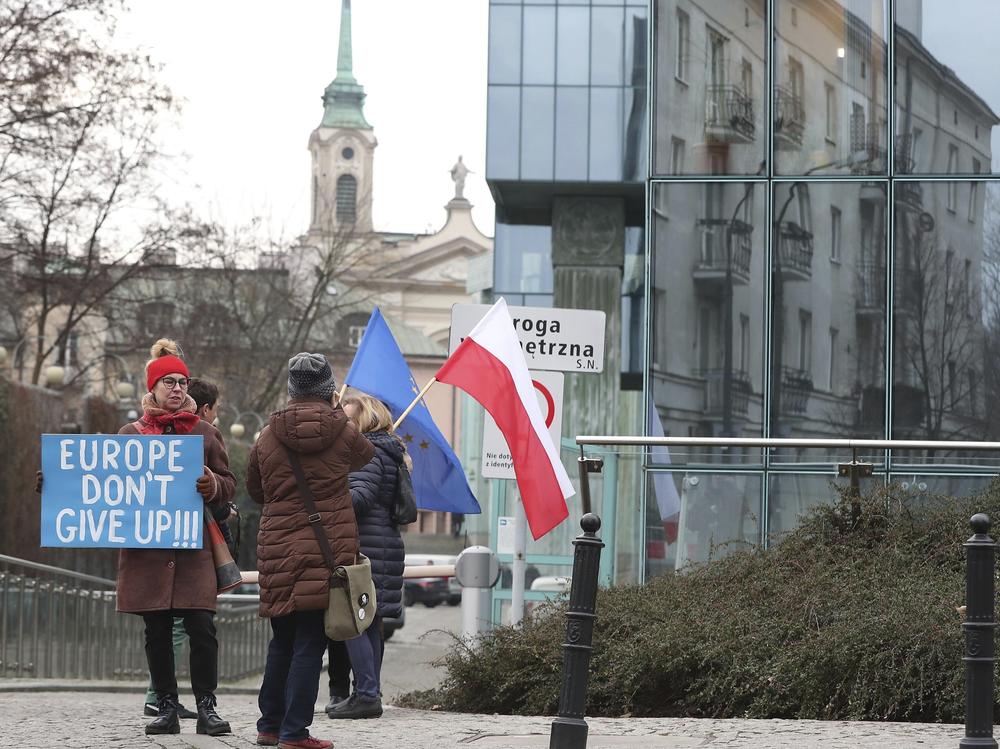 Protesters gather outside Poland's Supreme Court in January, demonstrating against the government's efforts to curtail the judiciary's independence. The European Commission is investigating Poland and Hungary for violating standards of democracy and rule of law.