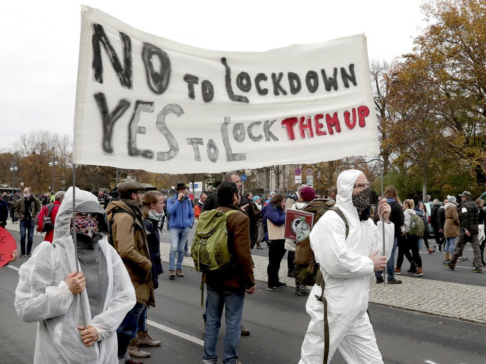 Demonstrators rally Wednesday against pandemic restrictions in front of the Brandenburg Gate in Berlin.