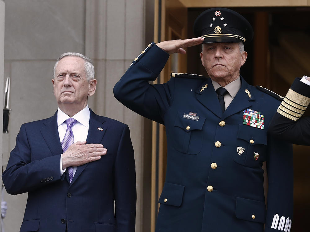 Former Defense Secretary Jim Mattis, left, and former Mexican Defense Secretary Salvador Cienfuegos Zepeda at the Pentagon in 2017. A U.S. district judge dropped drug charges against Cienfuegos Wednesday.