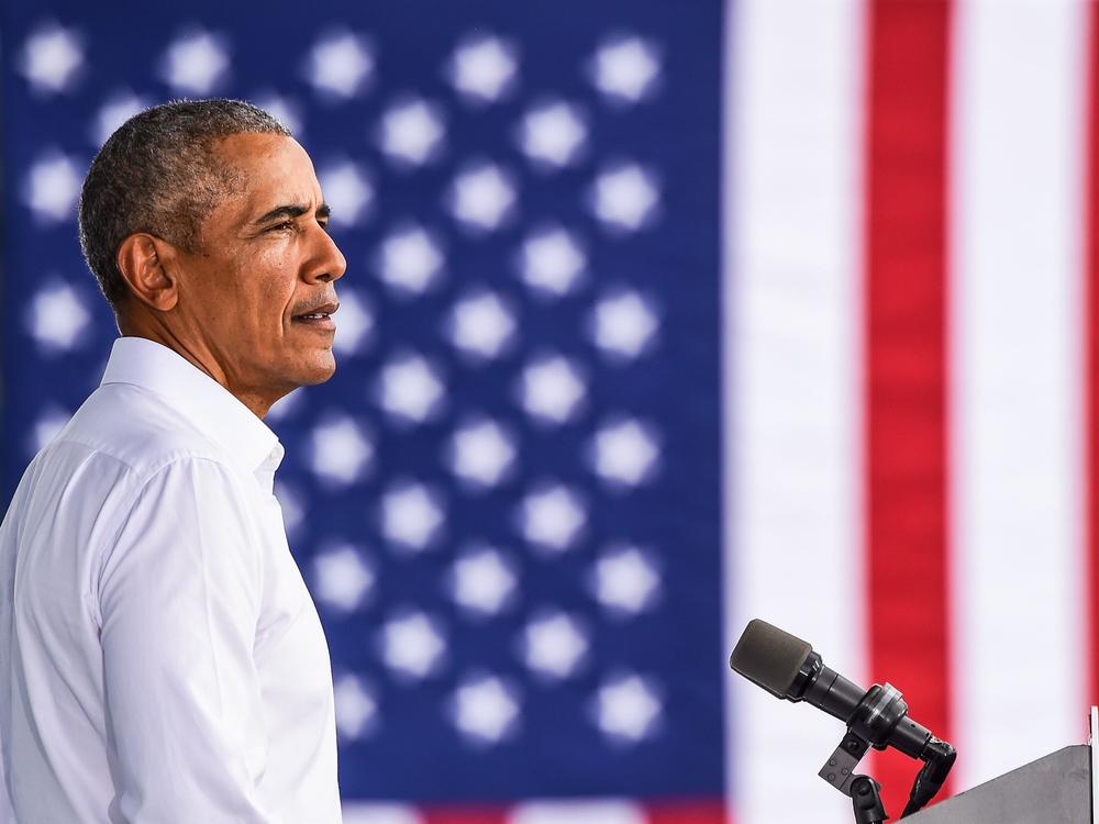 Former President Barack Obama speaks at a Biden-Harris drive-in rally in Miami on Oct. 24. In his first interview with Terry Gross, Obama talks about what he misses most about being president and reflects on the turmoil of the Trump White House. Obama's new memoir is <em>A Promised Land.</em>