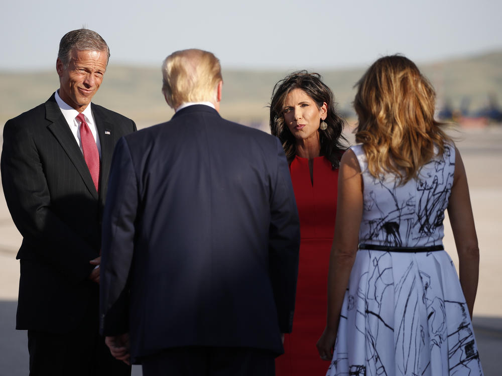 Sen. John Thune, R-S.D., and Gov. Kristi Noem greet President Trump and first lady Melania Trump upon arrival in Rapid City, S.D, in July. Trump was en route to Mount Rushmore National Memorial.