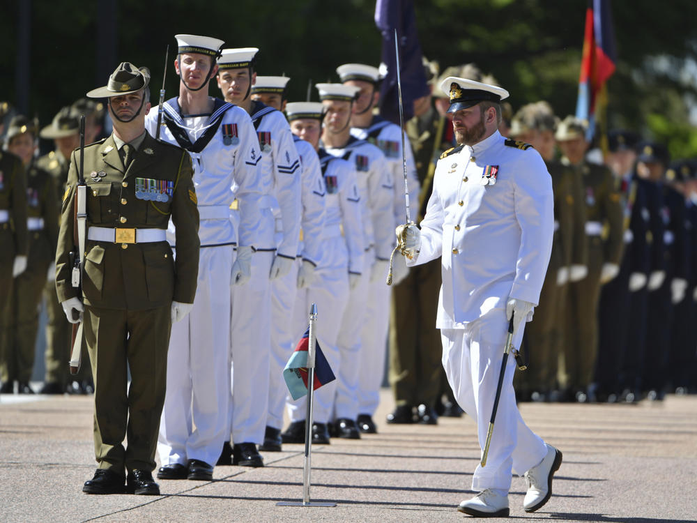 An honor guard is formed at Defence Headquarters in Canberra, Australia, before findings from the Inspector-General of the Australian Defence Force Afghanistan Inquiry are released on Thursday. A report found evidence that 25 soldiers unlawfully killed 39 Afghan prisoners, farmers and civilians.