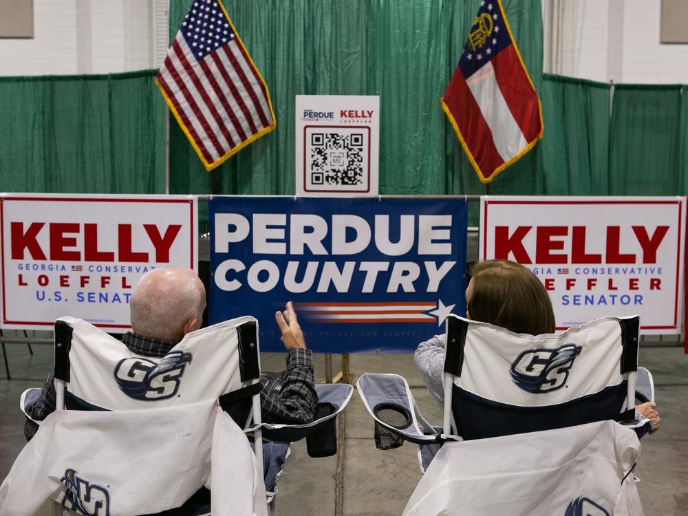 Supporters Ronnie and Linda Roberts wait for the start of the 