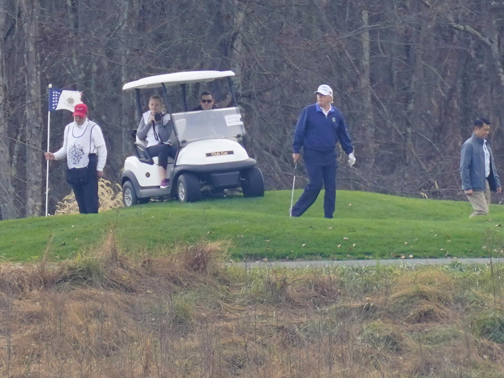 President Trump plays golf at Trump National Golf Club in Sterling, Va., as seen from the other side of the Potomac River in Darnestown, Md., on Sunday.