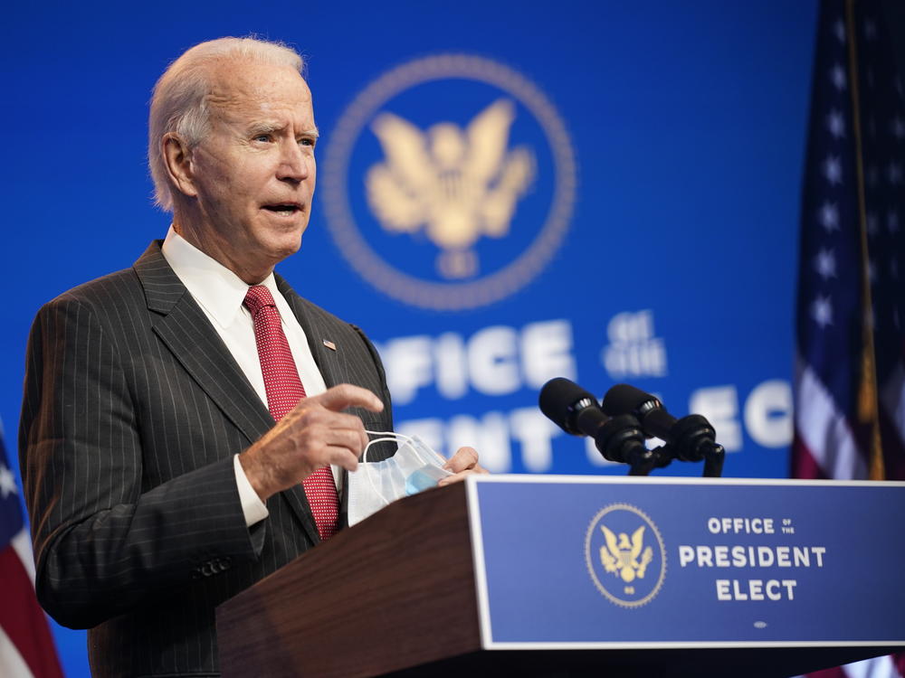 President-elect Joe Biden, accompanied by Vice President-elect Kamala Harris, speaks at The Queen theater, Thursday, in Wilmington, Del.