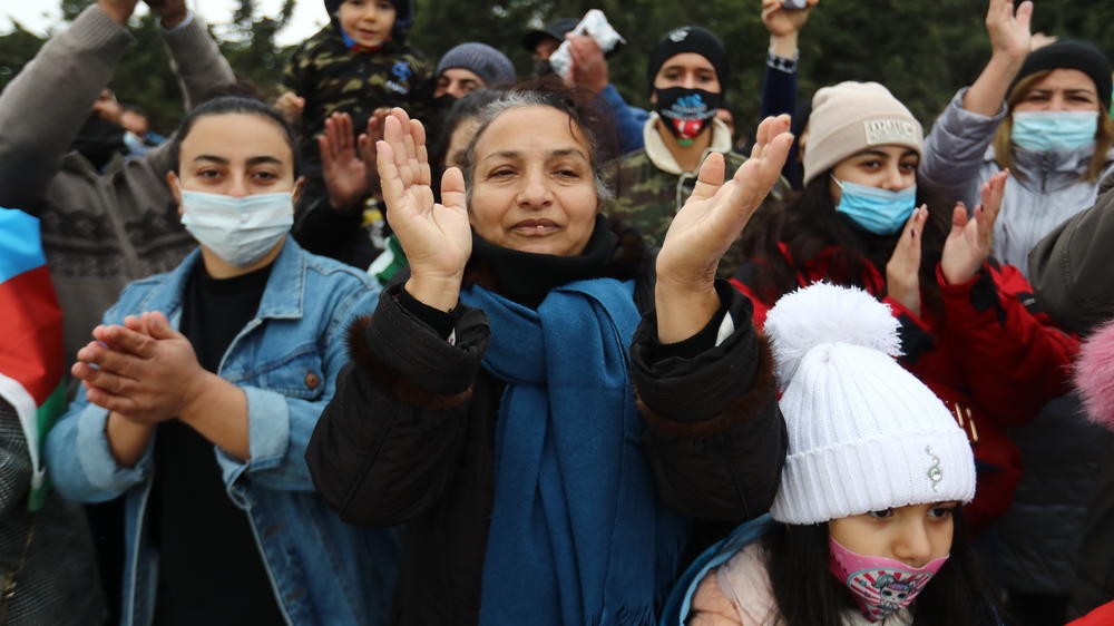 People in the Azerbaijani capital, Baku, gathered Friday to celebrate the entry of Azerbaijani troops into the district of Aghdam. The territory was among several ceded by Armenian forces in a cease-fire agreement that ended more than six weeks of heavy fighting.