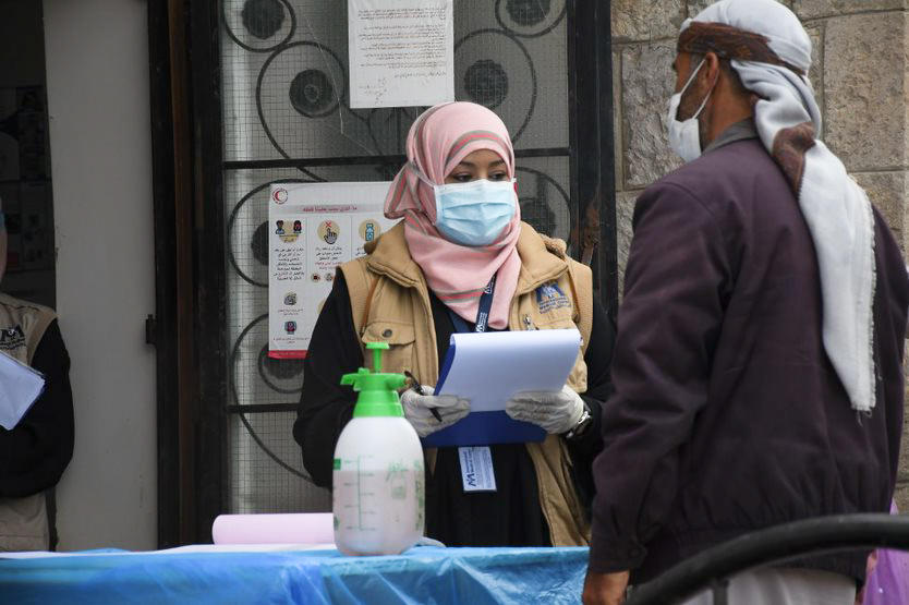 Dr. Nebras Khaled screens patients for symptoms of COVID-19 at a health facility in Sana'a, Yemen.