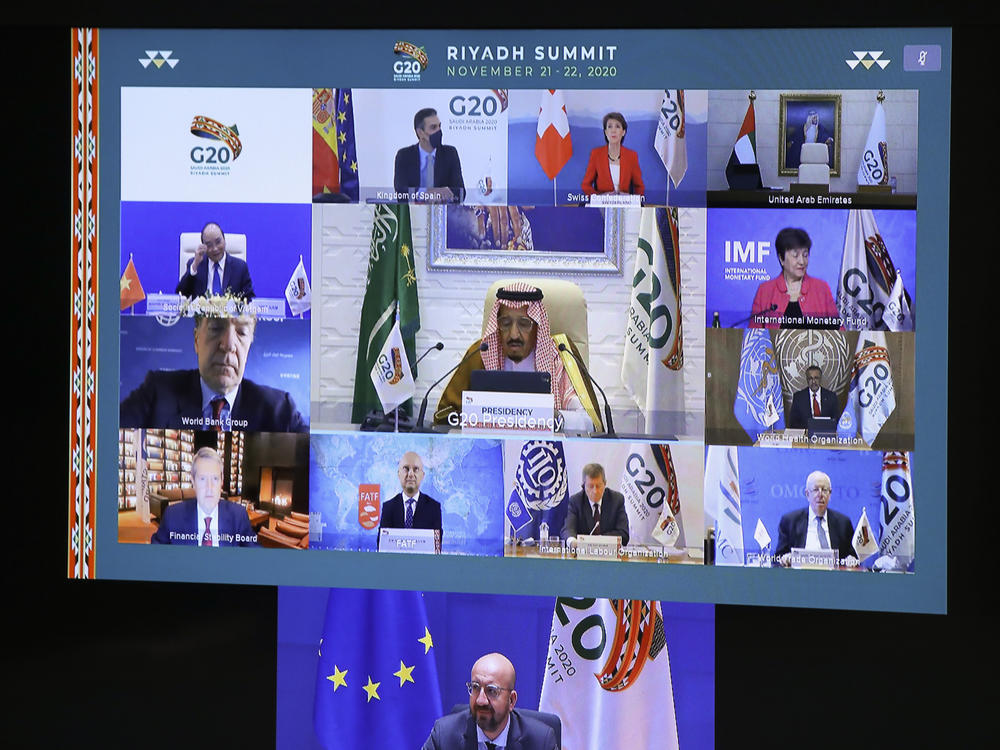 European Council President Charles Michel, on screen bottom, participates in a virtual G-20 meeting, hosted by Saudi Arabia, at the European Council building in Brussels on Saturday.