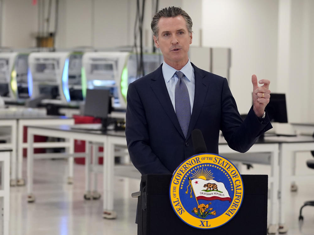 California Gov. Gavin Newsom speaks at a coronavirus testing facility last month in Valencia. Newsom says his family will quarantine for two weeks after three of his children came into close contact with someone who tested positive for the virus.