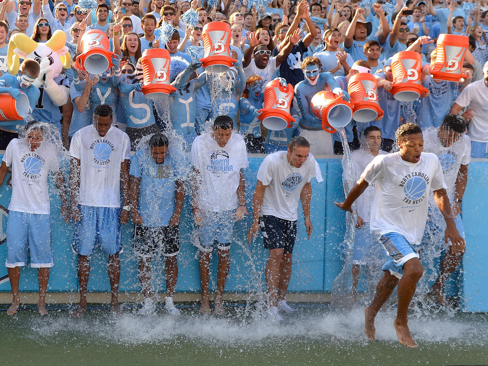 The North Carolina Tar Heels men's basketball team takes part in the the Ice Bucket Challenge, in 2014. At its height, the viral challenge attracted celebrities, famous athletes, and former presidents to take part.