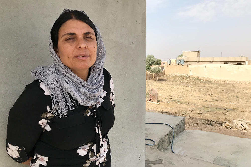 Kamo Zandinan in a village in the Sinjar region of northern Iraq. Zandinan returned to Sinjar in October. She is undergoing DNA tests conducted by investigators trying to confirm the identity of ISIS victims thrown into mass graves. Zandinan believes her husband and eldest son are among them.