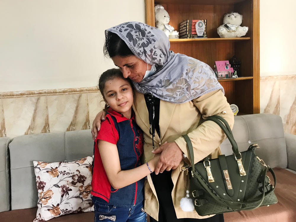 Kamo Zandinan says goodbye in the Mosul orphanage to a 10-year-old girl she believes is her daughter Sonya, taken from her by ISIS six years ago. The girl was rescued by police in March from an Arab family to whom she was not related. Zandinan is waiting for DNA tests to confirm whether the girl is her daughter.