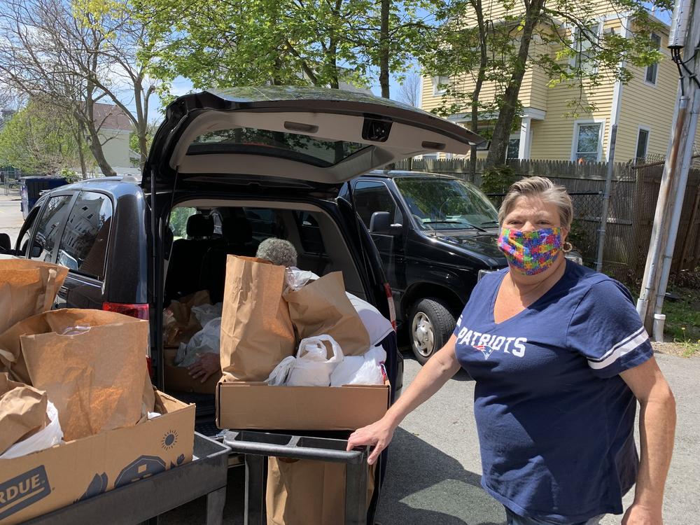 Jo-Ann Lessa delivers food with her van.