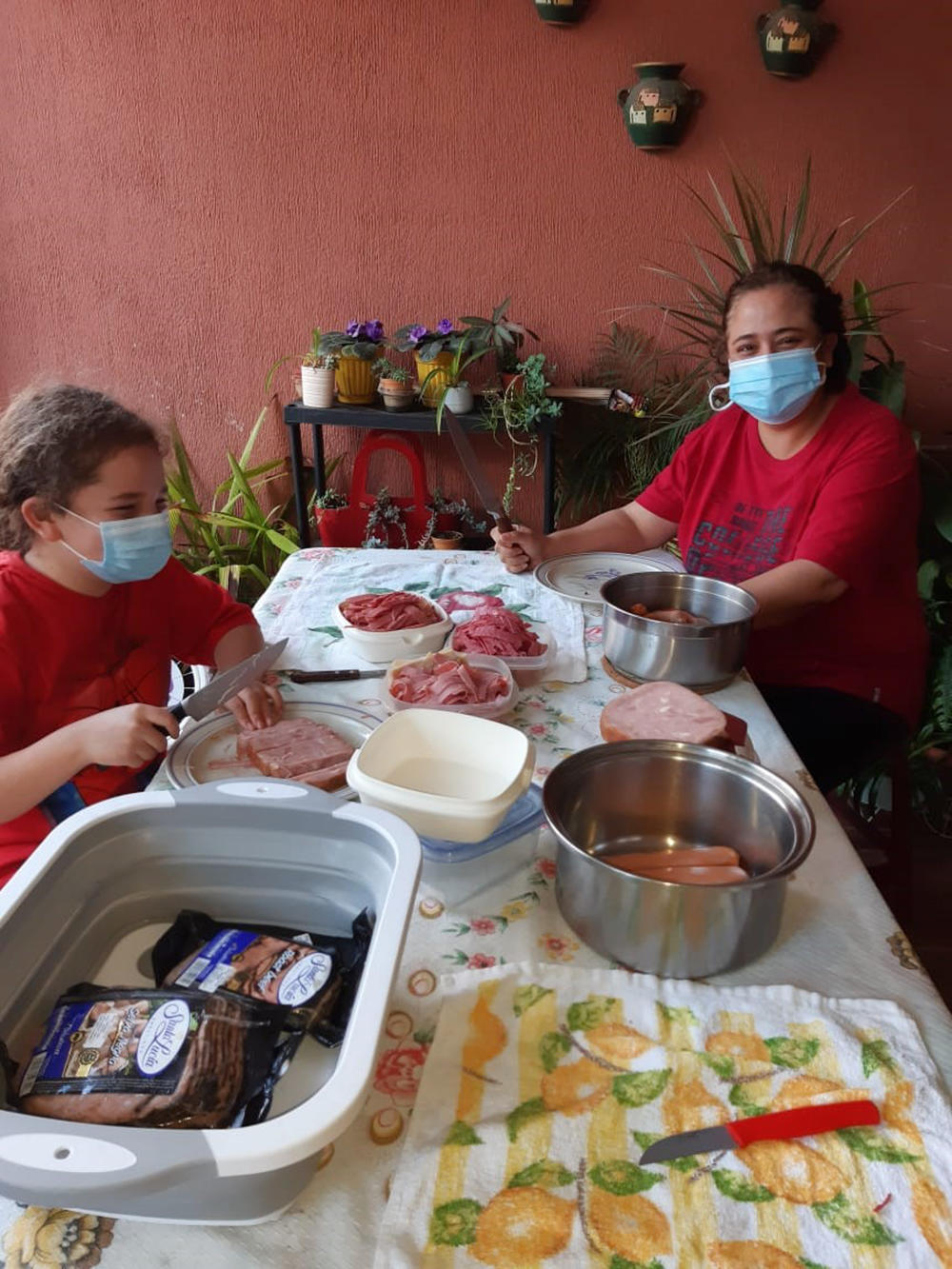 Pandemic food prep: Ana Michelle Dubon Estrada made fiambre, a traditional Guatemalan salad-like dish served on the Day of the Dead, with her daughter in her grandmother's garage — while grandmother called out instructions from a nearby doorway.