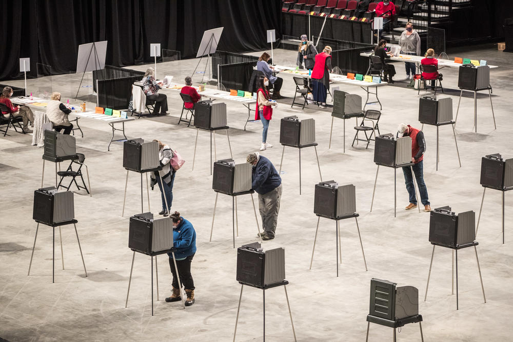 Voters fill out and cast their ballots on Election Day in Bangor, Maine. More than 150 million votes were cast in 2020, the highest voter turnout rate in more than a century.