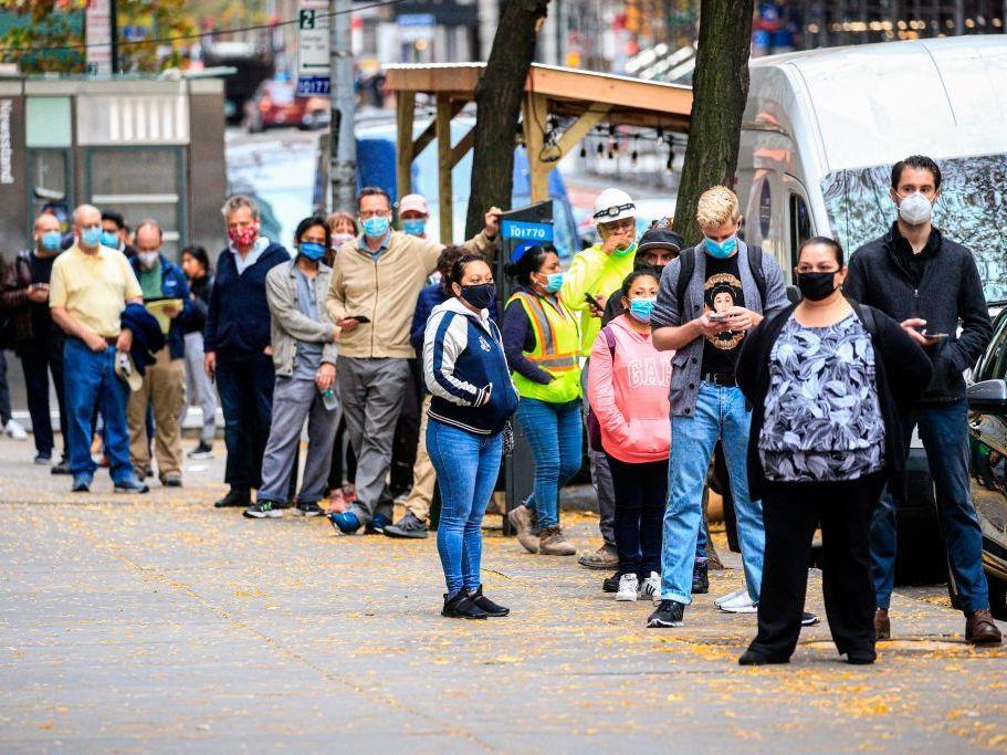 With new infections rising across the country, states are struggling to slow the spread, and testing can barely keep up. Here, people line up outside a coronavirus testing site this month in New York.