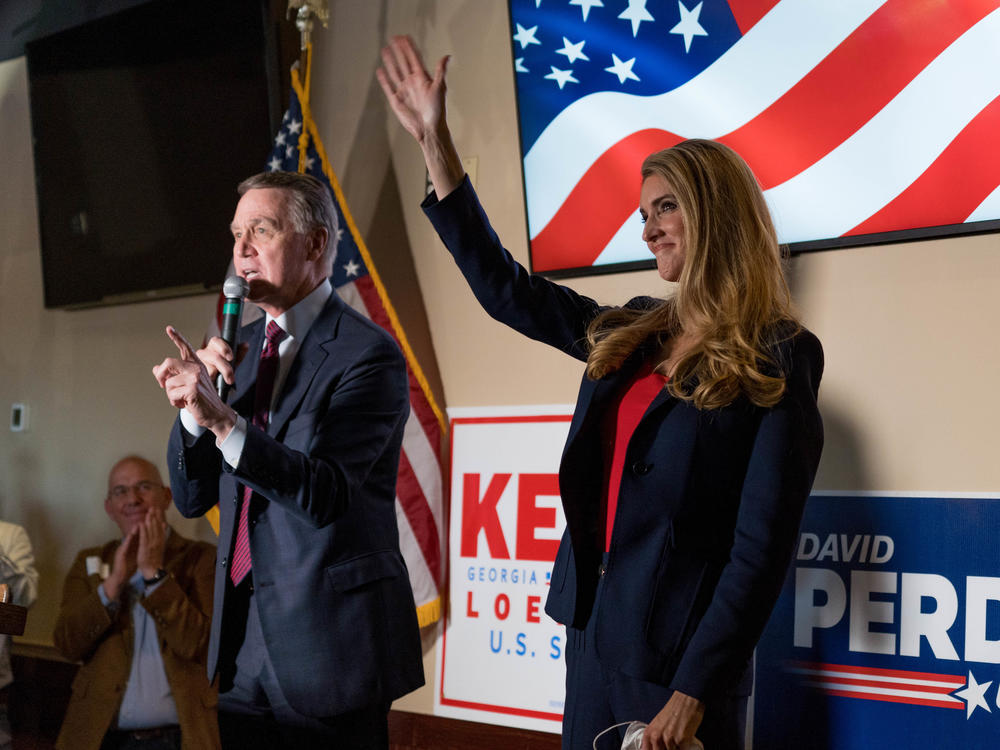 Sens. David Perdue and Kelly Loeffler speak at a campaign event this month at a restaurant in Cumming, Ga. Both are competing in runoff elections in January that will determine which party controls the Senate.