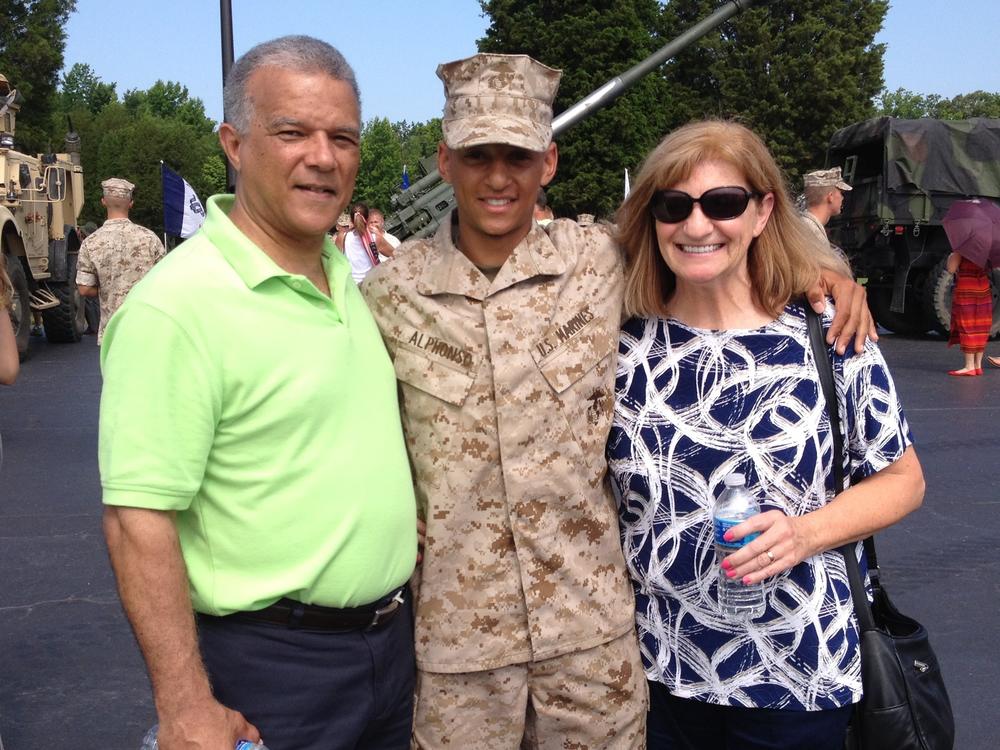 Marine Capt. Cristian Alphonso, center, pictured with his parents, Bonny, left, and Karen, right, in 2014. Alphonso was unable to visit his parents before an upcoming deployment because of Defense Dept. travel restrictions.