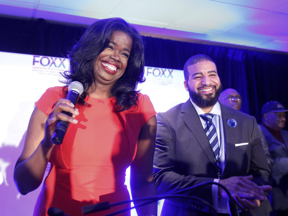 Then challenger Kim Foxx smiles at the crowd with her husband Kelley, as they celebrate her primary win as Cook County State's Attorney in 2016.