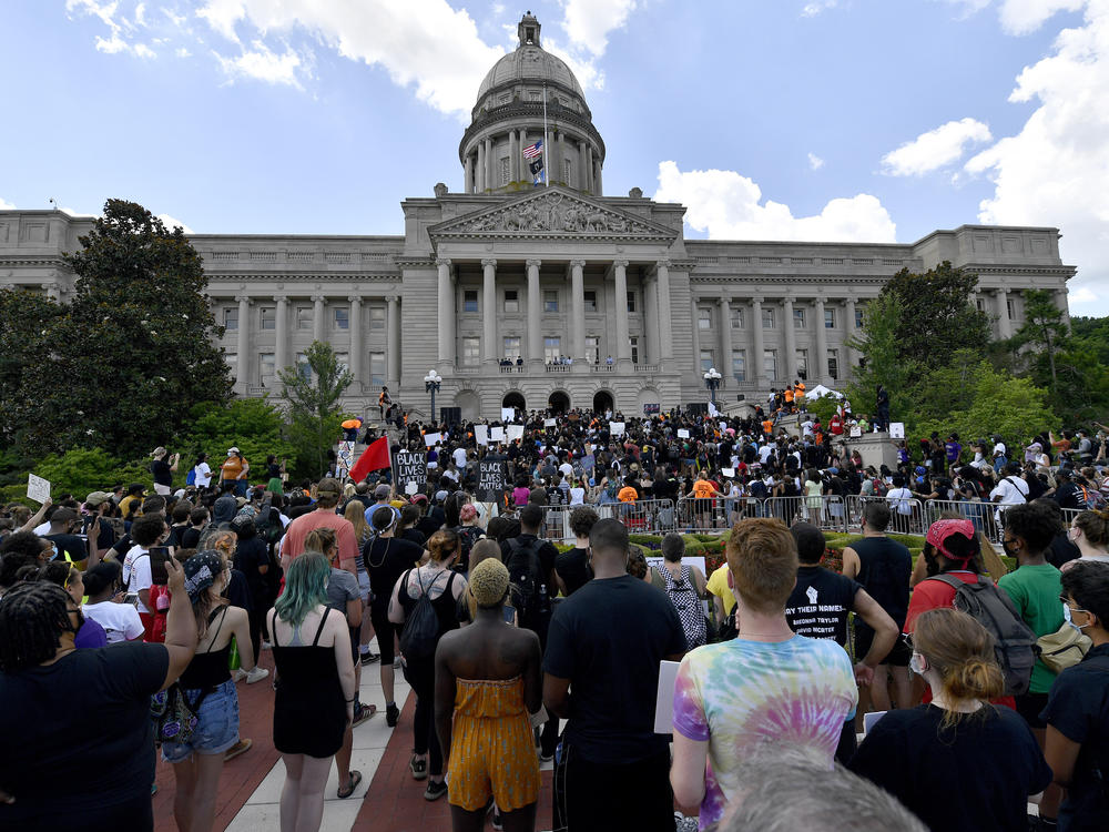 A crowd gathers for a rally to demand justice in the death of Breonna Taylor on the steps of the the Kentucky State Capitol in June. Taylor was killed in her apartment while Louisville police served a warrant.