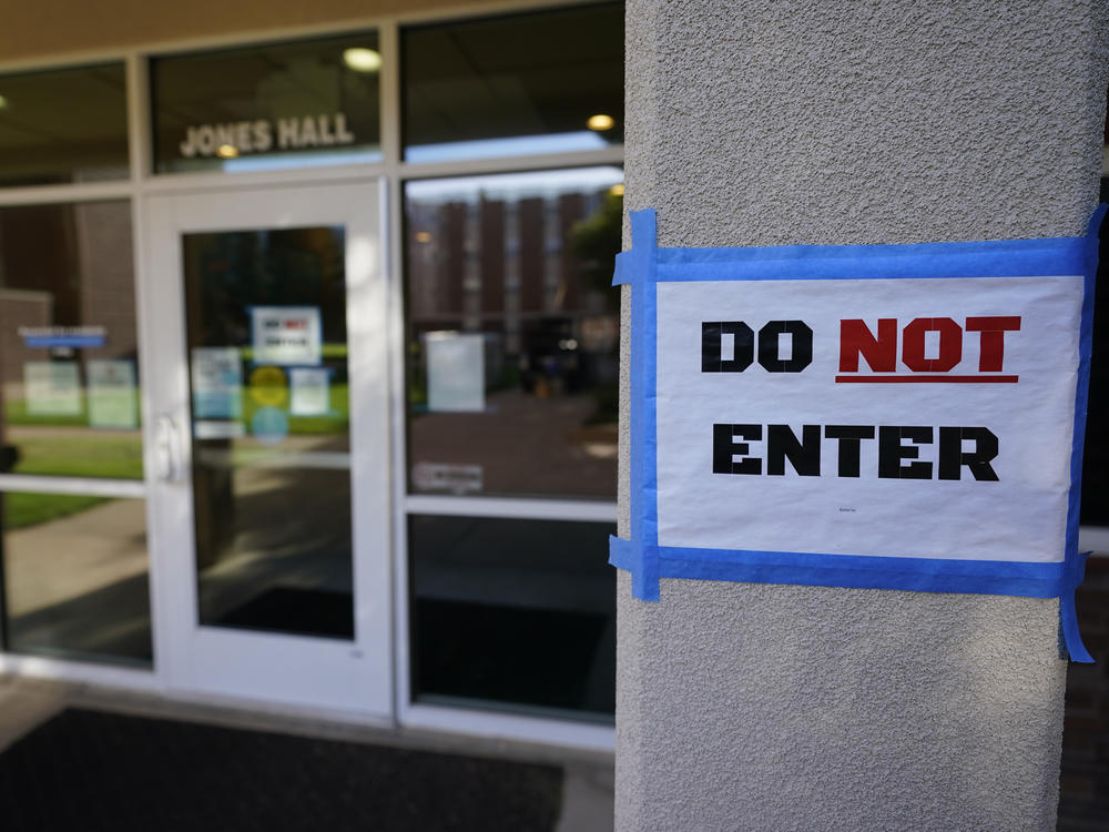 The doorway to Jones Hall is shown at Utah State University in September, where about 300 students were being quarantined to their rooms as a precaution.