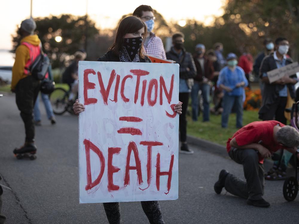 Housing activists gather in Swampscott, Mass., in October to call on the state's governor to support more robust protections against evictions and foreclosures during the pandemic.