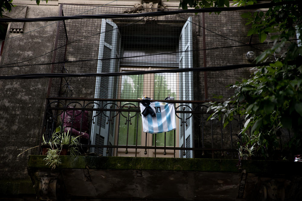 A jersey of Argentina and a black ribbon hang in a balcony after the news of the death of Maradona in Buenos Aires.
