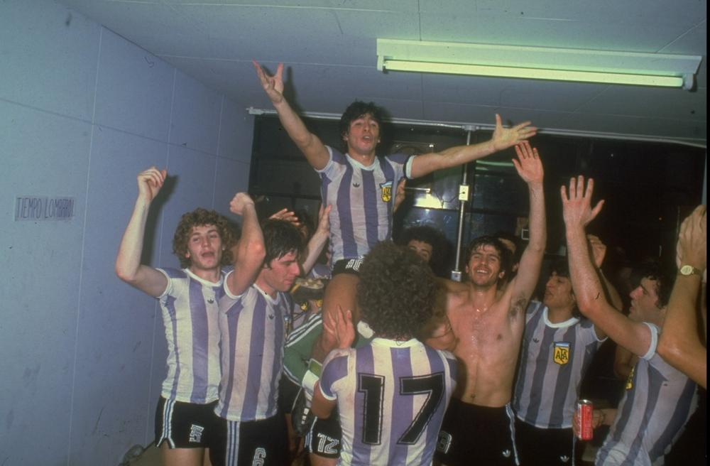 Maradona, center, celebrates with his teammates after winning a game.