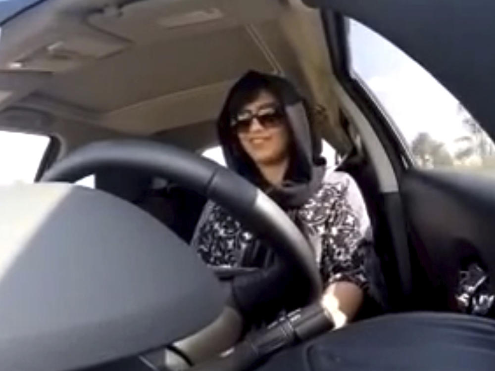 This Nov. 30, 2014 image made from video released by Loujain al-Hathloul shows her driving toward the United Arab Emirates-Saudi Arabia border before her arrest on Dec. 1, 2014, in Saudi Arabia. Al-Hathloul has been imprisoned for over two years and will be tried by a court established to oversee terrorism cases, her family said Wednesday.