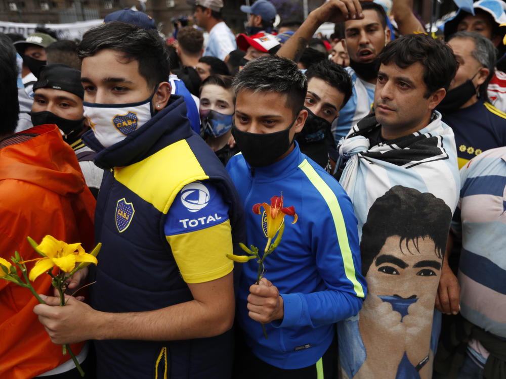 Fans line up to pay respects to Diego Maradona at the presidential palace in Buenos Aires on Thursday.