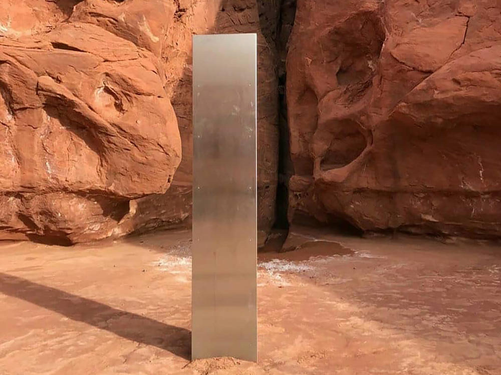 This Nov. 18 photo, provided by the Utah Department of Public Safety, shows a metal monolith in the ground in a remote area in Utah. The mysterious monolith has disappeared less than 10 days after it was spotted by wildlife biologists.